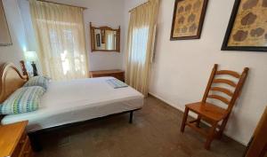 A bed or beds in a room at Masia Rural Les Alsines