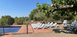The swimming pool at or close to Masia Rural Les Alsines