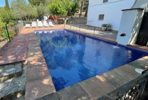 The swimming pool at or close to Masia Rural Les Alsines