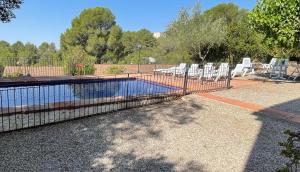 The swimming pool at or close to Masia Rural Les Alsines