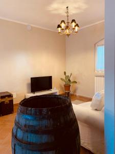 a room with a bed and a table with a laptop at La casa nei campi in Badia Pavese