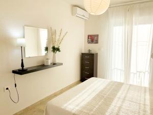 Postel nebo postele na pokoji v ubytování APARTAMENTO EN LA PLAYA CON VISTAS DE ENSUEÑO