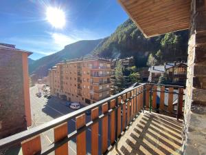 a balcony with a view of a city and mountains at Areny Arinsal hasta 6 personas in Mas de Ribafeta
