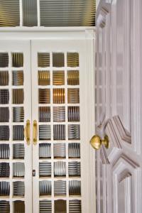 a door to a kitchen with plates on the shelves at Ursulino Valletta in Valletta