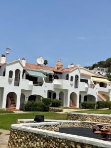 a large white building with a pathway in front of it at Casa Peña en Son Bou in Son Bou