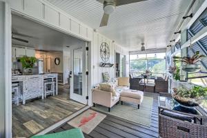 a living room with a couch and a table at Steps to Sand! Topsail Beach Group Getaway! in Surf City
