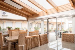 an outdoor patio with a table and chairs at Kaiser Panzió in Baja