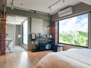 Katil atau katil-katil dalam bilik di 鬧鐘關掉旅店 Alarm Off B&B