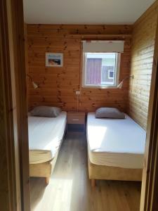 Postel nebo postele na pokoji v ubytování Rauðsdalur