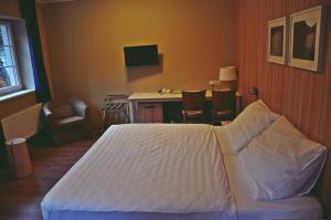 Postel nebo postele na pokoji v ubytování Wellness Hotel Bozeňov
