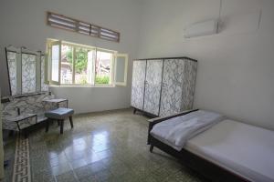 Postel nebo postele na pokoji v ubytování Kallista Homestay + 8 fotografií