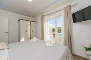 Postel nebo postele na pokoji v ubytování Villa San Antonio - Heated pool