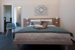 Postel nebo postele na pokoji v ubytování Brichett Deluxe Rooms