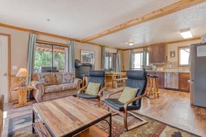 a living room with a couch and a table at Little Trail Lodge - Unit A in Government Camp