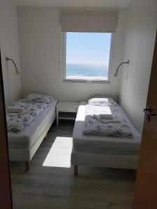 Postel nebo postele na pokoji v ubytování Rauðsdalur