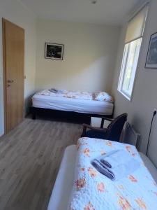 Postel nebo postele na pokoji v ubytování Rauðsdalur