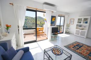 A seating area at Apartamento la vista, Frigiliana 2 bedroom apartment with amazing views, pool and free private parking HansOnHoliday Rentals