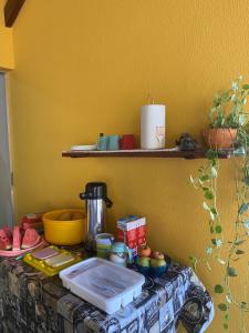 a table with a counter top with food on it at POUSADA LAR DA JOSÉFA in Estivado