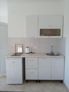 Kuhinja ili čajna kuhinja u objektu Maria's Apartment