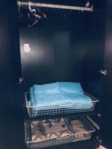 a bed is on a shelf in a room at 67-26 Austin Cove near subway, all shops, restaurants! Separate Entrance in New York