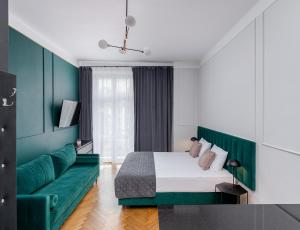 Łóżko lub łóżka w pokoju w obiekcie Wawel Boutique Residence - Krakow Old Town