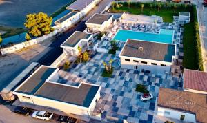 an overhead view of a house with a blue roof at PoolSide in Irsina