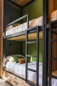 a bunk bed room with two bunk beds at Faz Hostel in Córdoba