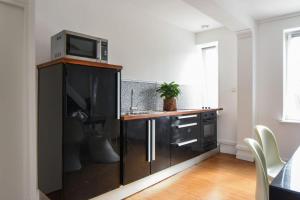 Kuchyňa alebo kuchynka v ubytovaní Appartement Pierre-Paul - Welkeys
