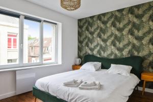 Posteľ alebo postele v izbe v ubytovaní Appartement Pierre-Paul - Welkeys