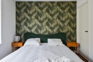 Posteľ alebo postele v izbe v ubytovaní Appartement Pierre-Paul - Welkeys