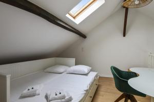 Posteľ alebo postele v izbe v ubytovaní Appartement Pierre-Paul - Welkeys