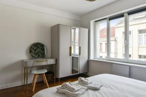 Posteľ alebo postele v izbe v ubytovaní Appartement Pierre-Paul - Welkeys