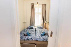 Posteľ alebo postele v izbe v ubytovaní Pat & Mat Apartment