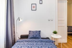 Posteľ alebo postele v izbe v ubytovaní Pat & Mat Apartment