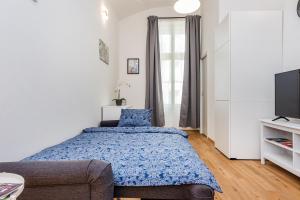 Posteľ alebo postele v izbe v ubytovaní Pat & Mat Apartment