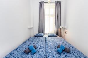 Posteľ alebo postele v izbe v ubytovaní Pat & Mat Apartment