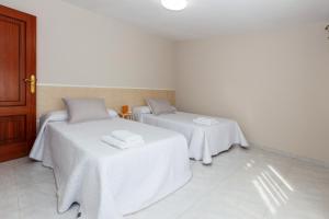 Postel nebo postele na pokoji v ubytování Casa Adriana