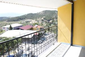 a balcony with a view of a parking lot at Ümit 2 Termal Apart Pansiyon in Pamukkale