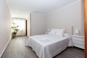Postel nebo postele na pokoji v ubytování Casa Adriana