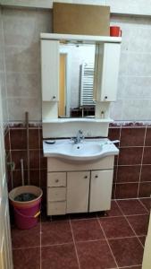 a bathroom with a sink and a mirror at Vault of istanbul in Istanbul