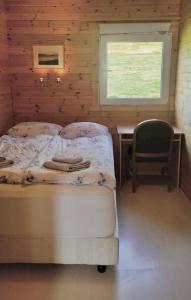 Postel nebo postele na pokoji v ubytování Rauðsdalur