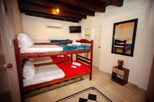 Casa Hotel Marbella Beach客房内的一张或多张床位