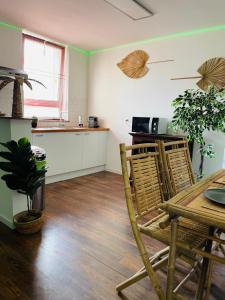 a kitchen with a table and chairs in a room at BaLille in Lille