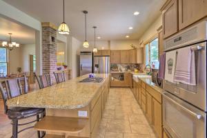 a kitchen with a large island with a counter top at Fruita Victorian Home with Hot Tub and Mountains! in Fruita