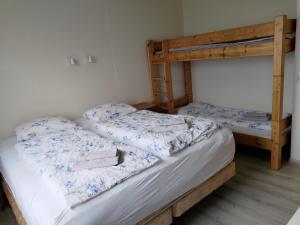 Postel nebo postele na pokoji v ubytování Rauðsdalur