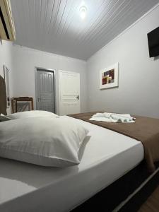 Postel nebo postele na pokoji v ubytování POUSADA ALEFER