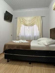 Postel nebo postele na pokoji v ubytování POUSADA ALEFER