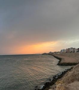 a view of the beach at sunset at Au dix sept in Dakhla