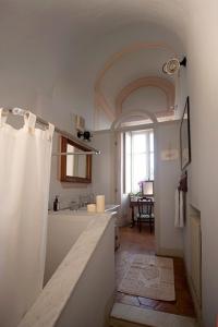 a kitchen with a sink and a counter top at Castello di Coazzolo in Neive