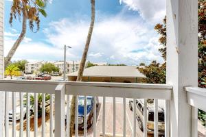 a view from the balcony of a condo with parked cars at Indian Lake 317 in Destin